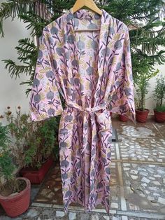 This Robe we makes from 100% Cotton printed fabric. The fabric print is Anokhi Floral which is very popular in all over the world . We use pure cotton cambric fabric . This is free One size robe . There is both side pocket in robe. Length = 120 cms. ( 48 inches) Pink Cotton Sleep Robe, Printed Cotton Robe For Home, Printed Cotton Lounge Dress, Multicolor Cotton Bedtime Dress, Pink Printed Dress For Loungewear, Multicolor Cotton Robe With Floral Print, Fitted Multicolor Cotton Sleepwear, Cotton Floral Print Dress For Sleepover, Beach Cotton Nightgown With Floral Print