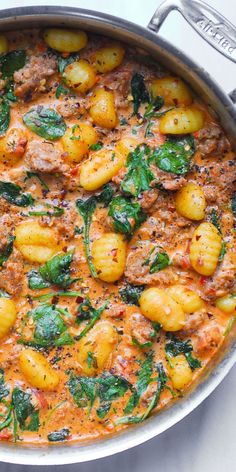 Creamy Sausage Gnocchi with Spinach and Tomato Sauce in a stainless steel pan Gnocchi With Tomato Cream Sauce, Gnocchi Tomato Cream Sauce, Jamie Oliver Recipes 30 Minute Meals, Tuscan Sausage Gnocchi, Creamy Sausage Gnocchi, Gnocchi With Spinach, Sausage Gnocchi, Pasta Sausage