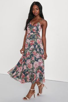 Stroll into the party with confidence, 'cause no on will be able to match your look in the Lulus Delightfully Divine Navy Blue Floral Chiffon Wrap Midi Dress! Airy woven chiffon, with a romantic floral print throughout, falls from adjustable spaghetti straps to form a surplice bodice with long sash ties that thread and secure around the waist. Skirt has an overlapping silhouette and falls to a flirty midi hem. Fit: This garment fits true to size. Length: Mid-calf length. Size medium measures 44.