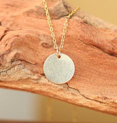 Gold disc necklace - gold dot - gold circle necklace - simple - everyday necklace - a 14k gold filled disc on a 14k gold vermeil chain A simple and classy, ultra feminine 14k gold filled disc hanging from a 16 inch 14k vermeil chain. Please feel free to select a different length chain if you prefer! ♥ Handmade with love in sunny California ♥ This gem will arrive happily in a gift pouch or box More from BubuRuby? https://www.etsy.com/shop/BubuRuby?ref=hdr_shop_menu Looking for other charm necklac Gold Disc Necklace, Gold Circle Necklace, Gold Disc, Gold Dots, Everyday Necklace, Disc Necklace, Circle Necklace, Simple Necklace, Gold Vermeil