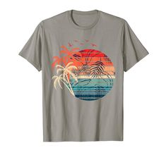 PRICES MAY VARY. If your favorite holiday is a tropical summer vacation then this design is exactly for you! Grab this design when your vacay mode is on or if you feel summer vibes on a tropical holiday trip to an exotic beach with sunset and coconut palm trees! Lightweight, Classic fit, Double-needle sleeve and bottom hem Relaxed Fit T-shirt With Palm Tree Print For Vacation, Beachy T-shirt With Palm Tree Print For Vacation, Tropical Vacation T-shirt With Palm Tree Print, Cheap Palm Tree Print T-shirt For Beach Season, Cheap Palm Tree Print T-shirt For Vacation, Coconut Palm Tree, Coconut Palm, Tropical Holiday, Exotic Beaches