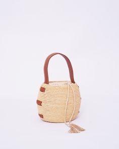 Do you want to look stylish and hippy? Get your hands on this handmade straw bag. It's high quality, eco-friendly, and handcrafted by women in Morocco. Its design is unique and timeless. Get yours now! we are proud to introduce our signature straw french bag to you. it is handmade by our talented artisan who has been working with us for years. this beautiful bag has a unique design that you would find nowhere else. the light and durable material are ideal for taking the bag on your adventures. S Palm Leaf Crochet Bucket Bag For Vacation, Handwoven Natural Bucket Bag For Beach Season, Handwoven Natural Fiber Bucket Bag For Vacation, Natural Handwoven Bucket Bag For Beach Season, Woven Natural Fiber Bucket Bag For Vacation, Bohemian Brown Bucket Bag For Beach Season, Brown Bohemian Bucket Bag For Beach Season, Bohemian Straw Bag With Tassels For Beach Season, Summer Brown Crochet Bag With Tassels