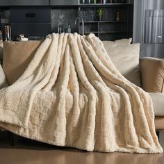 a couch with a blanket on top of it