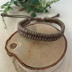 Boho style bracelet, made of waxed cord, perfect for wear on your weekends on the beach!  Embrace the beauty of simplicity with our Wax Cord Bracelet. The natural and organic look of the waxed cord gives this bracelet a rustic charm, allowing you to effortlessly incorporate it into your everyday style. It's a piece that resonates with the simplicity of nature. Perfect gift for your surfer friends. ♥ ITEM DETAILS: Total length: The size of the bracelet is adjustable. The bracelet for women closes approximately 6", and the bracelet for men has an adjustable closure that will fit a 7" wrist. Materials: Waxed cord.  Waxed Cord Available: Light Brown with Dark Brown  Waxed Cord Size: 1.5mm waxed cord  ♥ GIFT IT Jewelry comes in a cute bag ready to gift! If you wish your item to be a gift, pleas Casual Braided Bracelet With Adjustable Cord, Casual Everyday Braided Bracelet With Adjustable Cord, Everyday Braided Bracelet With Sliding Knot, Casual Friendship Bracelets With Adjustable Waxed Cord, Casual Everyday Friendship Bracelets Waxed Cord, Casual Everyday Friendship Bracelets With Waxed Cord, Adjustable Waxed Cord Bracelets For Everyday, Adjustable Nylon Cord Braided Bracelets For Everyday, Adjustable Nylon Cord Braided Bracelet