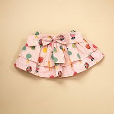 Super Cute Two Tier Skirt For Baby Girl. Featuring An Elastic Waist Band And Bow Detail. Skirt Is Made Of A Blush Colored Base With A Soft, Breathable Certified Organic Cotton To Make For A Comfy, Non Toxic, Durable & Eco-Friendly Choice. Ethically Produced By Small Farmer Sourced Organic Cotton At Fairtrade Certified Facility In India. 100% Organic Cotton Care Instructions: Machine Wash Cute Ruffled Mini Skirt, Cute Cotton Tiered Dress, Playful Cotton Skirt For Spring, Cute Skirt For Spring Playtime, Cute Spring Skirt For Playtime, Cute Cotton Skirt, Cute Cotton Dress With Tiered Skirt, Cute Spring Playtime Skirt, Cotton Skirt For Summer Playtime