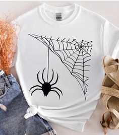 About this item Spider web t-shirt, Halloween shirt, customer t-shirt, Happy Halloween , designer shirt, desıgn gift, funny  special shirt, spooky season, Gildan unisex t-shirts We make design t-shirts, sweatshirts and hoodies that you can use at every special moment of your life and give as a gift to you and your loved ones... We are looking forward to adding color to your life... *  We use the Gildan Soft Style brand.  ---How To Order --- * Please, check and review all photos * Choose your t-s Halloween White T-shirt With Sublimation Print, White Halloween T-shirt With Sublimation Print, Casual Halloween T-shirt For Gift, Short Sleeve Halloween Top As Gift, Halloween Graphic Tee With Custom Print, Funny Halloween T-shirt With Screen Print, Halloween Custom Print White T-shirt, White Halloween T-shirt With Custom Print, Halloween Graphic Print Top As Gift