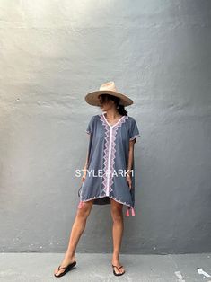 🙏🏻 please read measurement inch:Cm🙏🏻 This is a light soft comfy beautiful kaftan maxi dress. It is made of light soft Rayon  The dress  embroidery detail and tassel  Kaftan dress is perfectly in tune with the season's bohemian mood but is also a timeless choice for summer.  Photo -Model  size  Tall / 174cm /5.7 ft. Size fit - Medium Kaftan Dress size: USA /S~ L (one size) Color- Gray -tassel- Length - front& Back 92cm/36.22inch/3.01ft               Chest/140cm /55inch 4.59ft)round) 👉Dress i Vacation V-neck Kaftan With Tassel Ties, Bohemian Cover-up For Beach Season, Hippie V-neck Cover-up For Vacation, Bohemian Short Sleeve Summer Cover-up, Casual Festival Cover-up With Tassels, Short Sleeve Beach Dress For Festival Season, Beach Season Festival Dress With Short Sleeves, Short Sleeve Beach Dress For Beach Season Festivals, Bohemian Summer Kaftan For Vacation