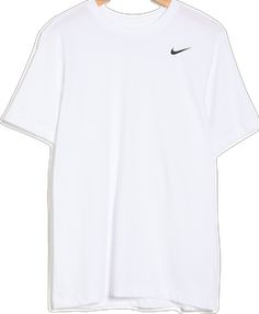 a white t - shirt hanging on a wooden hanger with a black nike logo