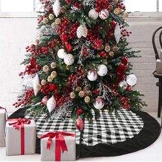 a decorated christmas tree with red and white ornaments