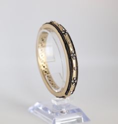 This Matt Gold Bangle is 10mm wide and has a magnetic clasp. The channel-set cubic zirconia stones are embedded in the bangle, and the antique edge adds a unique touch. Black Bracelets, Gold Bangle Bracelet, Gold Bangle, Magnetic Clasp, Tennis Bracelet, Gold Bangles, Bangle Bracelet, Bangle Bracelets, Cubic Zirconia