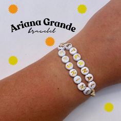 The perfect bracelet to wear as a fan of Ariana Grande.  All bracelets are handmade to order.  Please message me with any specific size measurements, standard bracelet size is approximately 7inches. White Spiritual Beaded Bracelets For Friendship, Spiritual White Beaded Bracelets For Friendship, Adjustable Beaded Bracelets With Letter Beads As Souvenir, Personalized Adjustable Beaded Bracelets As Souvenir, Adjustable Spiritual Wristband With Letter Beads, Spiritual Adjustable Wristband With Letter Beads, Handmade Symbolic Beaded Bracelets For Friendship, Personalized Spiritual Gold Friendship Bracelets, Personalized Gold Spiritual Friendship Bracelets