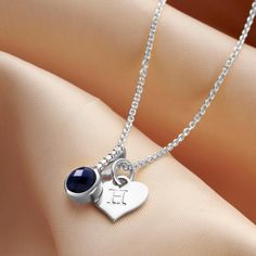 This faceted sapphire gemstone birthstone necklace is cast in sterling silver with a little row of genuine sparkling diamonds. Sapphire is the birthstone for the month of September. Customise your diamond birthstone necklace by have an uppercase letter or significant number hand stamped onto the sterling silver heart charm.  You could add your own initial to this semi precious birthstone necklace or your child, wife or girlfriend's. You might like to add numbers to commemorate a milestone birthd Heart Shaped Letter, 45th Anniversary Gifts, September Birthstone Necklace, Blue Tissue Paper, Sapphire Birthstone, 45th Anniversary, Blue Sapphire Necklace, Sweet Necklace, Diamond Birthstone