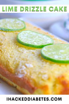 a close up of a cake with limes on it and the words lime drizzle cake