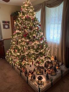 a decorated christmas tree in a living room