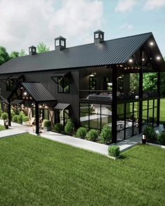 an artist's rendering of a large black barn style home in the middle of a grassy area