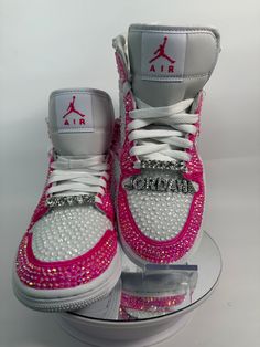 Step up your sneaker game with some fully blinged Jordan 1 mids. These shoes are a great addition for prom, a birthday, a wedding, a night on the town, or your  next event! These shoes can be customized to the colors of your choosing. Not looking for Jordan 1's? Message me with your shoe choice. I'd love to create the custom shoe of your dreams. Please note, shoe charms are not included in the listing but are available as a bonus add on. Please see my listing entitled EXTRAS to add shoe charms.  *Disclaimer We are not associated with the brand, I only hand customize the shoes using rhinestones. Rhinestone Sneakers, Jordan 1 Mids, Casual Shoes Women Sneakers, Bedazzled Shoes, Nike Shoes Women Fashion, Pretty Sneakers, Custom Rhinestone, Nike Fashion Shoes, Preppy Shoes