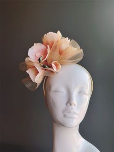 fascinator headpiece with elegant magnolia or orchid flowers on top of gold tulle, perfect for tea parties, derby events, and other special occasions! Thank you for supporting small businesses and we hope our products bring you and your loved ones Joy & Happiness! S H I P P I N G  -   Last minute masquerade mask shopping? 24 hr processing available. Pick appropriate shipping method and leave us checkout note! 1-2 day guaranteed delivery services also offered, add items to cart and click on shipping tab for rates.  Pls leave a check out note with your need date & contact number (especially for expedited and custom orders) Msg for delivery time frames (Include your state/country). S I Z E Adult size. Detailed dimensions are available upon request. C O N T A C T Text: 1-516-654-4643 Email: La Elegant Spring Fascinator With Matching Headband, Flower-shaped Party Fascinator With Flower Decoration, Garden Party Flower Hat With Handmade Flowers, Adjustable Fascinator With Matching Headband For Garden Party, Whimsical Flower-shaped Fascinator With Handmade Flowers, Adjustable Handmade Flowers Headband For Garden Party, Kentucky Derby Party Fascinator With Flower Decoration, Whimsical Headpiece With Handmade Flowers For Kentucky Derby, Whimsical Flower Fascinator For Parties