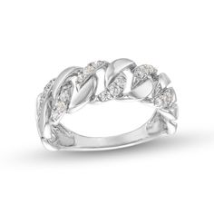 a white gold ring with diamonds in the center and leaves on each side, set against a