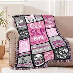 a couch with a pink and black blanket on it that says best sale ever in different languages