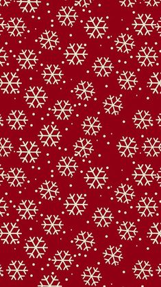 a red background with white snowflakes on it's sides and dots in the middle