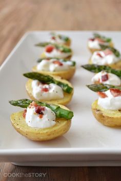 small appetizers on a white plate with the words too cute written above them