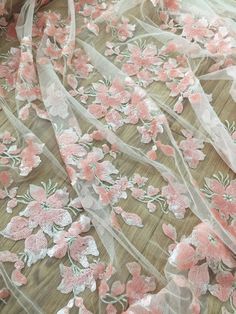 pink and white flowers on sheer mesh fabric