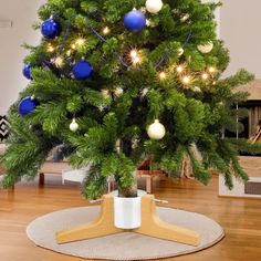 a small christmas tree with blue and white ornaments