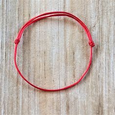 Karma and Luck Red String Bracelet A wonderful gift to give to family members, new couples, best friends, wedding or engagement and many more! *Made with high quality 1mm satin cord *They are adjustable, and one size fits most.   *They are 100% handmade and made in non-smoking environment. Red string bracelets are believed to provide help and love to everyone around them. This has been a movement and so many people including Leonardo DiCaprio, Madonna, Miley Cyrus, Nicole Richie, Rihanna, Demi Moore, Britney Spears, Zac Efron, Lauren Conrad, Chris Brown are part of this. You, too, can make a difference by becoming a part of this movement by wearing one of the red string bracelets!  It is said that the left side of the body is the receiving side, so wearing it on the left side allows the re Red Minimalist Bracelet For Everyday, Red Minimalist Bracelet For Everyday Wear, Minimalist Red Bracelets For Everyday, Minimalist Red Everyday Bracelet, Red Personalized Spiritual Bracelets, Personalized Spiritual Red Bracelets, Personalized Red Spiritual Bracelets, Red Adjustable Bracelets For Everyday, Adjustable Red Bracelets For Everyday