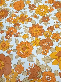 an orange and yellow flower pattern on a white background