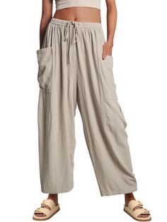 PRICES MAY VARY. The perfect summer, vacation, lounge, going out, staying in, casual, dress up or down pants! Thess harem-inspired pantslooks good on every body type, with every outfit, and are even comfy enough to nap in Crafted from soft breezy linen blend fabric, this pant is as comfortable as it is classic. It is designed in a wide-leg silhouette and features elastic waistband, drawstring detail and dropped side pockets for added volume. Pair it with your favorite tee or effortlessly thrown Summer Vacation Harem Pants Ankle-length, Baggy Harem Pants With Pockets For Vacation, Baggy Harem Pants For Vacation, Wide-leg Harem Pants For Beach Season With Pockets, Wide Leg Harem Pants With Pockets For Beach Season, Summer Vacation Wide-leg Harem Pants, Non-stretch Leisure Bottoms For Summer, Cotton Vacation Pants With Pockets, Beach Harem Pants With Pockets For Spring