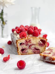 raspberry cake with white chocolate frosting and fresh raspberries