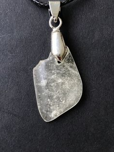 "LIBYAN DESERT GLASS - GREAT SAND SEA - EGYPT - CABOCHON PENDANT NECKLACE - AMAZING - EVERY NECKLACE IS HAND MADE AND UNIQUE. ABSOLUTELY AMAZING SPECIMEN WITH FEW NATURAL INCLUSIONS. Libyan Desert Glass cabochon necklace- LDG - Top GEM quality - completely translucent with inclusions \"free\" shape - mirror polished on both sides - 2.5 g. Picture were taken by daylight (outside). Libyan desert glass, 29 million years ago was probably formed when an asteroid or comet hit the surface of the earth Silver Drop Glass Jewelry, Silver Glass Drop Jewelry, Silver Glass Teardrop Jewelry, Silver Teardrop Glass Necklaces, Clear Sea Glass Jewelry Gift, Clear Sea Glass Jewelry For Gift, Clear Sea Glass Jewelry For Gifts, Clear Glass Drop Jewelry, Clear Drop-shaped Glass Jewelry