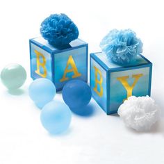 baby blocks with balloons and tissue balls on them