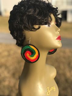 a mannequin head with earrings on it