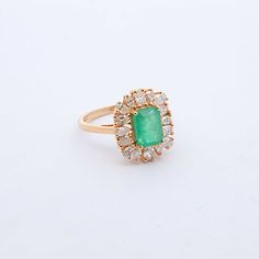 Indulge in luxury with our exquisite Emerald and Diamond Cocktail Ring. Adorned with stunning emeralds and diamonds, this ring exudes sophistication and elegance. Elevate any outfit with this timeless piece, perfect for any occasion. Feel like a true icon when you wear our Emerald & Diamond Cocktail Ring. 14k Yellow Gold 1.75CTW Natural Emerald Natural Diamonds: .80CTW Round Diamonds Green Emerald Cluster Ring With Rose Cut Diamonds, Timeless Emerald Diamond Wedding Ring, Luxury Green Emerald Ring With Rose Cut Diamonds, Green Emerald Cut Diamond Ring With Rose Cut Diamonds, Luxury Emerald Ring With Rose Cut Diamonds For Anniversary, Classic Green Cluster Diamond Ring, Classic Green Cluster Emerald Ring, Green Diamond Ring For Formal Occasions, Elegant Green Diamond Ring With Center Stone