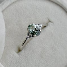 14k White Gold Aria Oval Green Sapphire Engagement Ring | Magpie Jewellery Simple Silver Diamond Ring, Simple Green Engagement Rings, Light Green Engagement Ring, Simple Silver Engagement Rings, Green Engagement Rings, Pretty Engagement Rings, Green Sapphire Engagement, Green Sapphire Engagement Ring, Ring Inspo