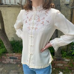 Vintage Hand Embroidered Mandarin Collar Silk Blouse In The Color White Long Sleeve White Silk Blouse Size - 32 Equivalent To Size Extra Extra Small Size - 34 Equivalent To Size Extra Small Size - 36 Equivalent To Size Small - Brand Is Peony - Brand New - Never Been Worn - 100 % Pure Silk - Multiple Sizes Vintage Embroidered Top For Spring, Traditional Long Sleeve Cream Blouse, Feminine Embroidered Cream Tops, Feminine Cream Embroidered Tops, Fitted Feminine Embroidered Top, Long Sleeve Embroidered Top For Spring Wedding, Classic Floral Embroidered Tops For Daywear, Feminine Long Sleeve Embroidered Tops, Elegant Cream Embroidered Top