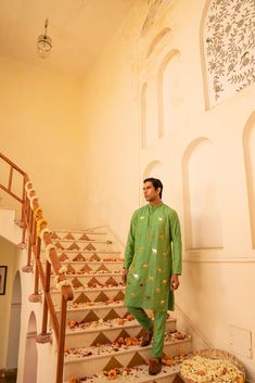 Kzari Opulent Avocado Green Crystal Mirror Kurta Set The Kzari Opulent Avocado Green Crystal Mirror Kurta Set is a luxurious and elegant ensemble that combines traditional craftsmanship with contemporary style. The kurta features intricate crystal mirror work on the front, adding a touch of glamour and sophistication. Paired with matching pants, this set is perfect for special occasions and festive celebrations. Features: Luxurious jacquard fabric Intricate crystal mirror work Vibrant avocado gr Luxury Pista Green Traditional Wear With Mirror Work, Luxury Green Kurta With Mirror Work, Pista Green Chanderi Kurta With Mirror Work, Festive Pista Green Kurta With Mirror Work, Pista Green Chinon Kurta With Mirror Work, Avocado Green, Mirror Work, Jacquard Fabric, Green Crystals