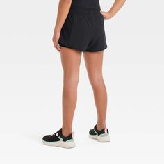 Why we're ALL IN: 2-in-1 shorts made with soft and stretchy fabric to help keep them comfortable through a range of activities, from running to sports practice and casual hangs. A full waistband elastic with drawcord closure makes for a stay-put fit, while a loose fit silhouette offers greater range of motion. All in Motion™: Made for every move, priced for every day.