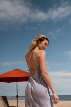 The Jenny Yoo Leilani slip dress is a chic and modern update to the classic slip dress. Featuring a V neck and a delicate spaghetti strap to highlight your shoulders and collarbone. The low scoop back has a barely there feeling, and the bias cut skirt slinks over every curve. A dainty tie at the back adds one last flirtatious detail. Available in Clay Rosette Pink and Oxford Blue. Ready to ship. Shop online now! V-neck Sundress With Delicate Straps For Brunch, V-neck Slip Dress With Delicate Straps, Chic Backless Dress With Spaghetti Straps And Built-in Bra, Chic Halter Dress With Spaghetti Straps And Back Opening, Vacation Dresses With Spaghetti Straps And Built-in Bra, Vacation Mini Dress With Delicate Straps And V-neck, Chic Spring Backless Dress With Built-in Bra, Elegant Backless Sundress With Adjustable Straps, Fitted Slip Dress With Tie Back For Brunch