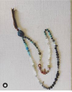 Embrace the spirit of adventure with our Travel Mala. Crafted from various precious and semi-precious gems collected from around the world, each bead is intentionally placed in an ombré style and hand-knotted. The guru bead and tassel are available in multiple options, allowing for personal customization. Each Mala takes 3-5 hours to assemble, symbolizing gypset travel adventures and featuring unique beads, shells, and seeds from different parts of the world. Every necklace is one-of-a-kind, and Ombre Fashion, Semi Precious Gems, Precious Gems, 5 Hours, The Spirit, Adventure Travel, Semi Precious, Hand Knotted, Around The World