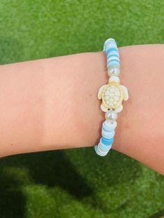 This is a super cute high quality beach turtle bracelet! It is great for the summertime! Cute Adjustable Stretch Bracelet For Vacation, Adjustable Cute Stretch Bracelet For Vacation, Trendy Beach Bangle Stretch Bracelet, Trendy Turquoise Vacation Bracelets, Trendy Turquoise Bracelets For Vacation, Summer Vacation Bangle Friendship Bracelets, Trendy Stretch Bangle Bracelet For The Beach, Adjustable Turtle Bracelet For Beach, Handmade Adjustable Turtle Bracelet