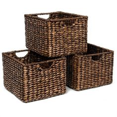 three brown wicker baskets stacked on top of each other