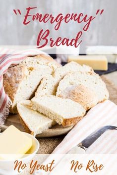 a loaf of bread sitting on top of a cutting board next to butter and cheese