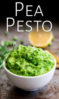 a white bowl filled with guacamole and garnished with cilantro