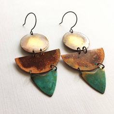 Inspired by the colors of Sedona, these earrings are made with oxidized metals using our verdigris green patina and our unique and original organic patina which creates orange and red on copper and brass.  Earrings are 3.5" long and hang from oxidized sterling silver ear wires.ssd jewelry © 2017Please not that the patina process is an organic process and shades of color will vary.  All of our items are HANDMADE and made to order and may take up to approx. 2 weeks to fabricate (not including ship Unique Multicolor Patina Jewelry, Unique Multicolor Jewelry With Patina, Artistic Copper Earrings With Patina, Vintage Hand Forged Copper Earrings, Vintage Copper Earrings With Patina, Vintage Bronze Earrings With Patina, Bronze Vintage Earrings With Patina, Unique Patina Copper Earrings, Bohemian Brass Earrings In Rust Color