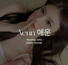 a woman laying on top of a bed next to her hand over her face and the words aeun ohe meaning love