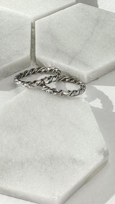 Handmade sterling silver stacking rings make a beautiful addition to any ring stack or worn alone. Adjustable Stackable Silver Midi Rings, White Gold Stackable Open Midi Rings, Stackable Twisted Rings For Promise, Silver Dainty Stackable Toe Rings, Dainty Adjustable Silver Stackable Rings, Dainty Silver Stackable Adjustable Rings, Modern Twist Stackable Rings For Promise, Modern Twist Stackable Twisted Promise Rings, Stackable Bands With Modern Twist