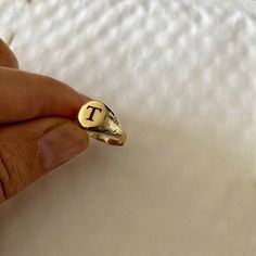 "Pinky ring, 14K solid gold ring. delicate, dainty and light Can be Engraved with letter, Initials in any language ✔ Made to Order ✔ Gold K: 14K ✔ Metal stamp: 14K ✔ Gold Color: Yellow Gold ✔ Ring size: Available in all ring sizes ✔ Face of the ring: 7mm ✔ Gold weight: 1.6 gram * ✔ Ready to Ship in 3-5 Business Days * The gold weight is for a 14k ring. A small difference that might occur depending on the size. Choose your size , and your word / name - in any language let me know in the \"note to Personalized 14k Gold Heirloom Initial Ring, 14k Gold Signet Ring With Initials For Promise, Gold Engraved Initials Ring In 14k, Rose Gold 14k Gold Rings With Initials, Dainty 14k Gold Stamped Signet Ring, Rose Gold 14k Stamped Initial Promise Ring, Dainty 14k Gold Signet Ring, Dainty Hallmarked Signet Ring For Promise, Dainty 14k Stamped Initial Promise Ring