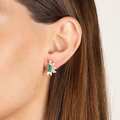 Our Helen earrings combine the timeless elegance of emeralds and diamonds in a contemporary design. Made with high quality cz diamonds and crystal emeralds set in gold plated sterling silver. Custom backs ensure the earrings sit perfectly on the ear. .6" L x .4" W Pierced. Stud style earrings Please contact us to special order larger quantities. Green Diamond Earrings For Evening, Green Diamond Drop Earrings With Accents, Green Cubic Zirconia Diamond Drop Earrings, Luxury Emerald Earrings With Diamond Accents, Elegant Green Diamond Earrings, Green Diamond Earrings For Parties, Luxury Green Diamond Earrings With Accents, Timeless Green Jewelry With Baguette Diamonds, Fine Jewelry Green Diamond Earrings